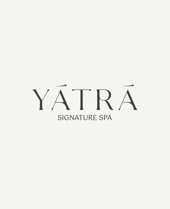 YĀTRĀ Signature Spa brand logo. A bespoke luxury wellness identity conceptualized and fully operated by COCON Group for the Montcalm Collection in London.
